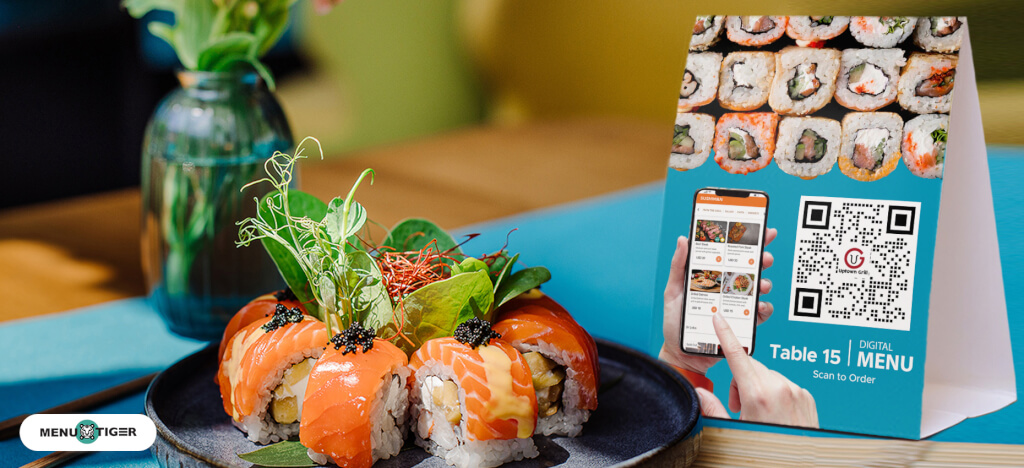Digital menu beside sushi