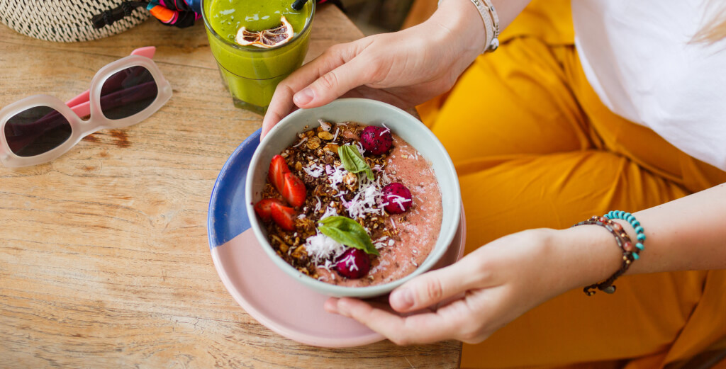 Person holding a smoothie bowl