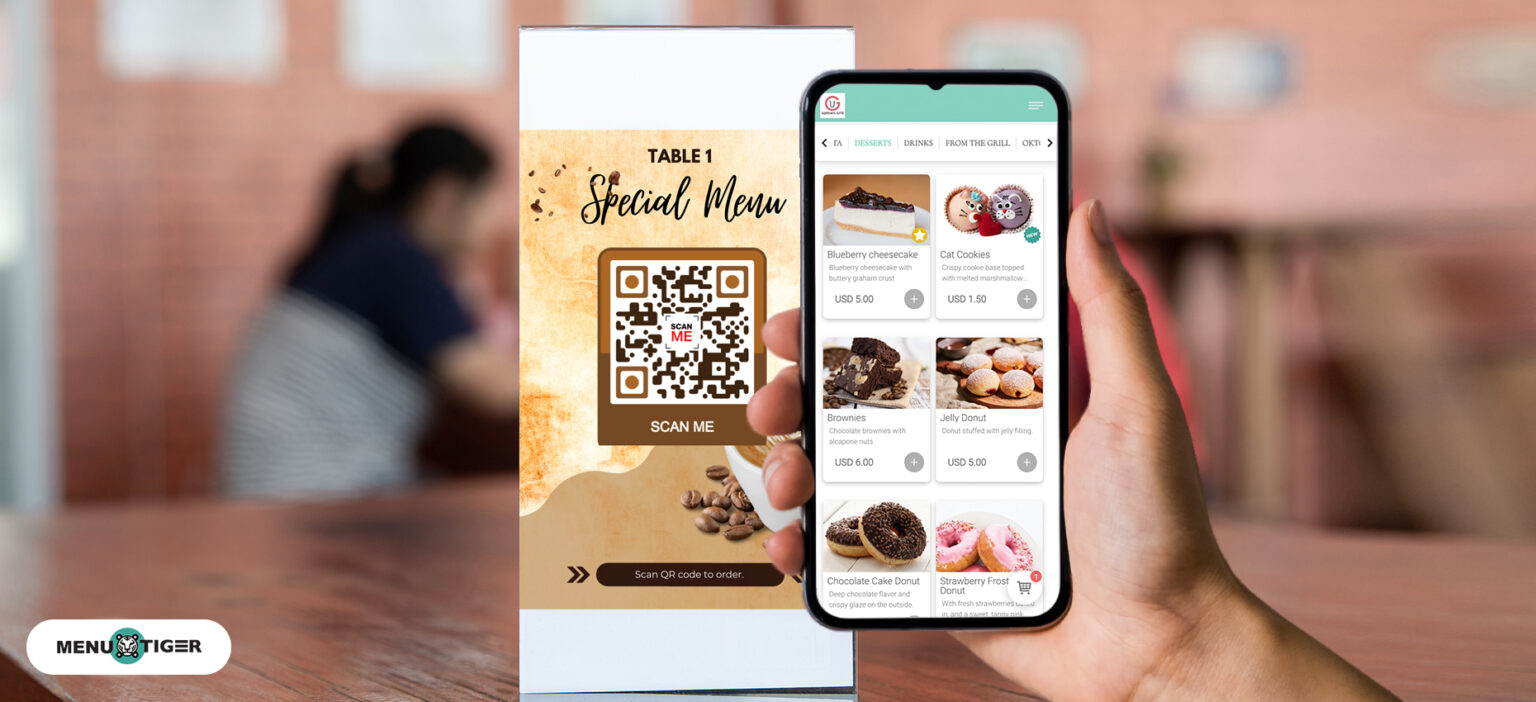 A chef using a tablet to update the restaurant's online menu in the kitchen.
